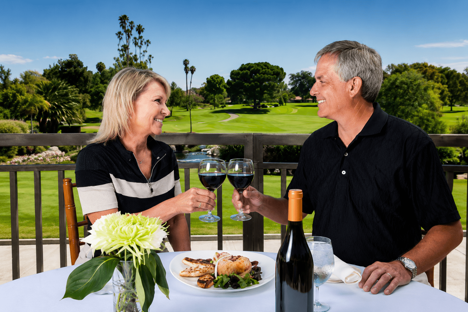 Couple enjoying drinks at golf resort